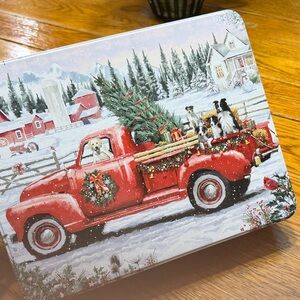 Christmas Scene 300 piece puzzle in a collector tin.  Originally a cookie tin.